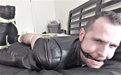 tiedupwithrope:HOT Leather guy nicely tied up and gagged.