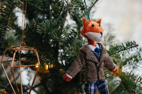 Mr. Fox is watching the snow fall from atop the Christmas tree. I wish I had his herringbone blazer 