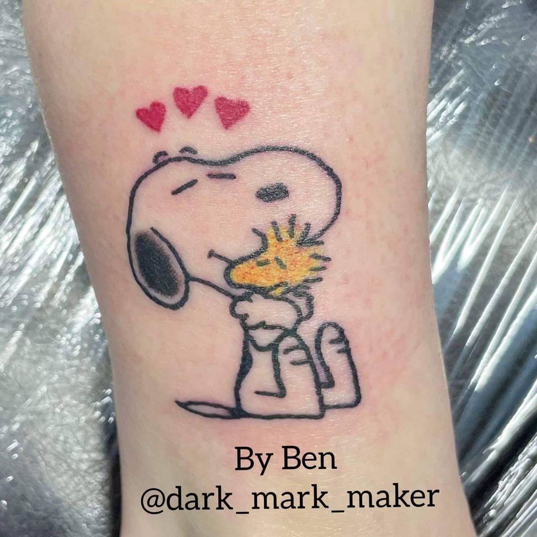 Charlie Brown and Snoopy tattoo on the lower back  Official Tumblr  page for Tattoofilter for Men and Women