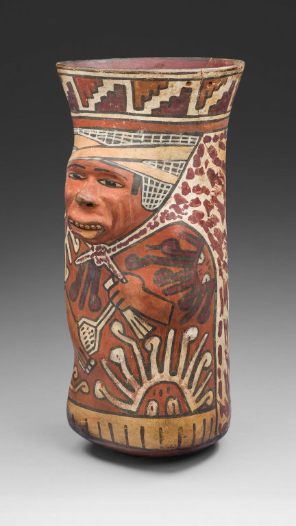 ~Beaker Molded in the Form of a Warrior Holding a Sling.
Date: 180 B.C. - A.D. 500
Medium: Ceramic and pigment
Culture: Nazca
Place of origin: South coast, Peru