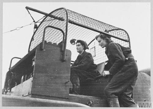 WAAF balloon operators at a London balloon site (January 1943). Original caption: During the raid by