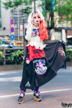 tokyo-fashion:  Kay - designer of the independent Japanese remake fashion brand Heiligtum - on the street in Harajuku wearing a remake punk top over a fishnet top, a Heiligtum remake skirt, ruffle corset, choker, and Vivienne Westwood rocking horse shoes.