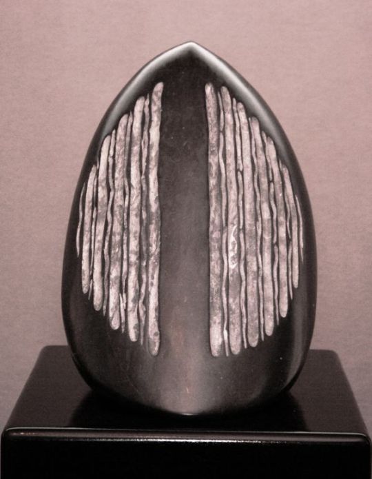 A sculpture titled Black Pod (Carved Stone Ripe Seed Pod sculpture) by sculptor Denis Yanashot. In a medium of Champlain Black Marble. #artist#sculpture#sculptor#art#fineart#Denis Yanashot#Marble#stone#limited edition