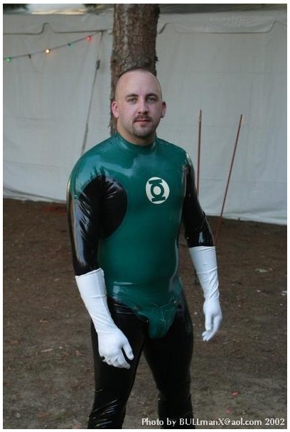 2manykinks:  rubbergloved:  The Green Lantern latex costume made by Chris may british designer  Reddy is SO cute as a rubber GL … tho I really wanted to see him get worked over by a villain.  ;)  Still, can’t beat white rubber gloves for maximum