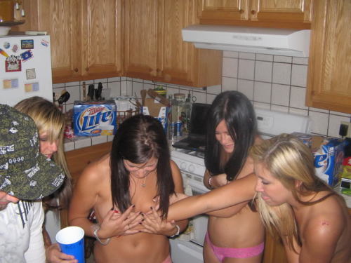 A fun strip flip cup game - the girls are already down to bras and thongs at the start of the photos