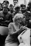 Marilyn Monroe signing autographs at the ceremonial kick off for a match at Ebbets Field in Brooklyn, New York, May, 1957