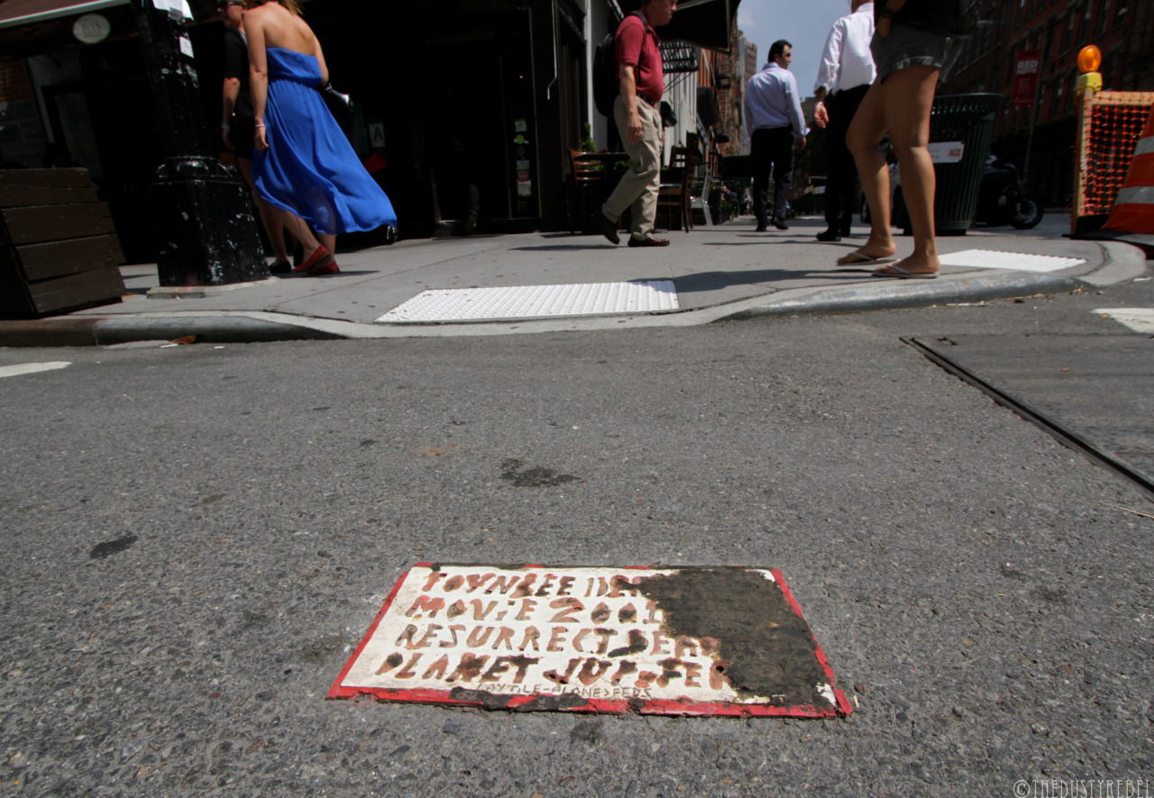 Toynbee Tile One of the many mysterious Toynbee tiles that have been popping up since the 80’s. This one, which could be a copycat, is located at the intersection of Greenwich Street and North Moore.
Text Reads:
Toynbee Idea In Movie 2001 Resurrect...