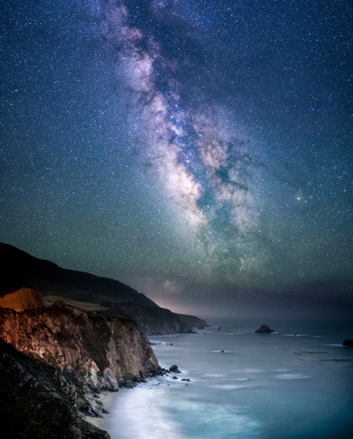 the-science-llama:  Galaxy Coast— Bill Shupp // Flickr  Taken near Bixby Bridge north of Big Sur, CA, this is a 12 shot vertical panorama taken around 4 am this past Monday, when the Milky Way was pretty high in the sky. The glow near the horizon is