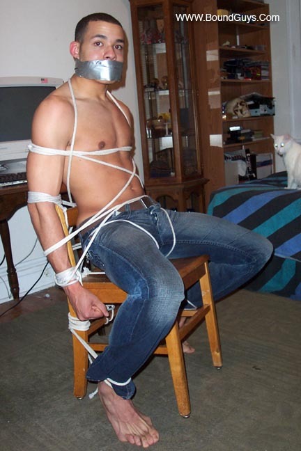 tightropesgagseu:  chairtiedguys:  A hot guy, rope, tape and tight denim….what more could you wish for? ;-) © www.boundguys.com  Sexy