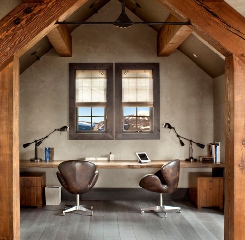 Rustic home office with beautifully distressed swan chairs.