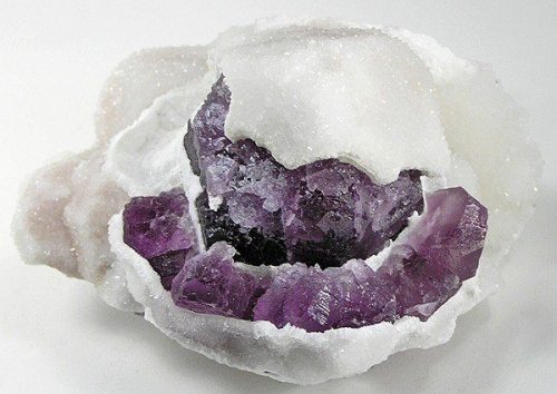 One mineral blanketing anotherA nice shiny covering of tiny white crystals of druzy quartz have grow