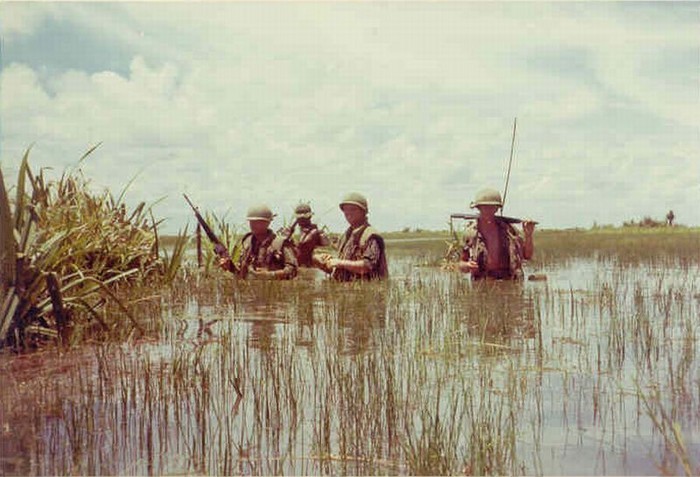 vietnamwarera:  31st Infantry Regiment soldiers wade through a rice paddy.