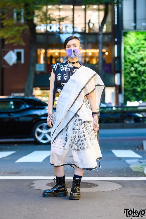 Japanese PHD neuroscience student Yoritam (she/they) on the street in Harajuku wearing a kanji print