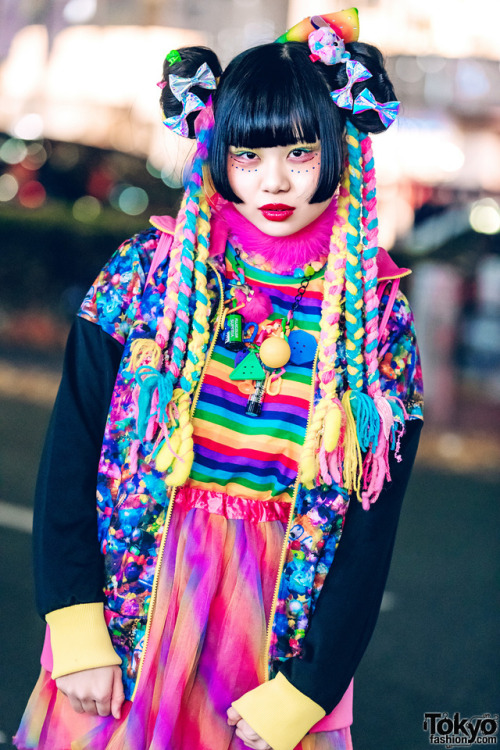 Japanese art student Chami on the street in Harajuku wearing a super colorful kawaii look with items