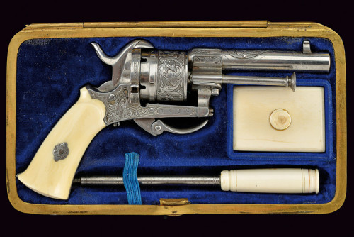 Cased, engraved, and ivory handled pinfire revolver originating from France, 19th century.