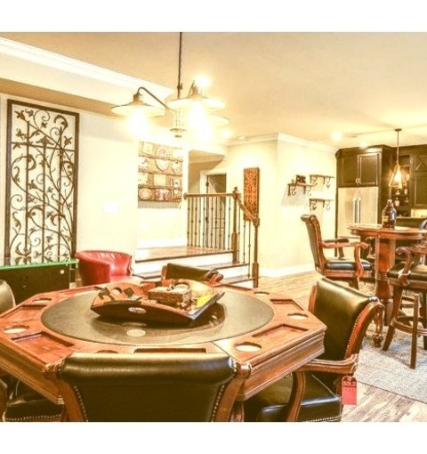 Enclosed In LouisvilleLarge, Elegant Image Of An Enclosed Game Room With A Medium-toned Wood Floor And