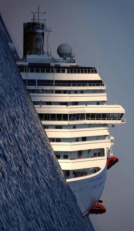 superstitious-scientist:sixpenceee:The wreck of the Costa Concordia photographed by a tilted camera.