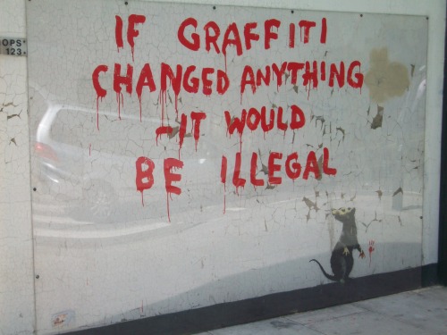 optates:  Banksy, a street artist whose identity remains unknown, known for his provocative stenciled pieces in the late 1990s.  