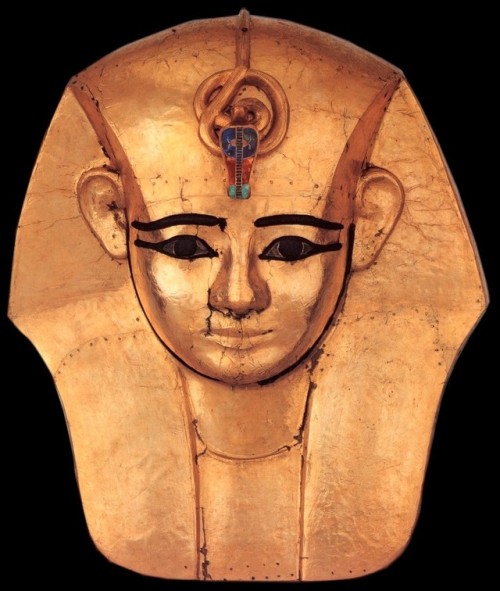 Mask of King AmenemopeThis mask was part of the mummy-shaped coffin of gilded wood of Amenemope. The