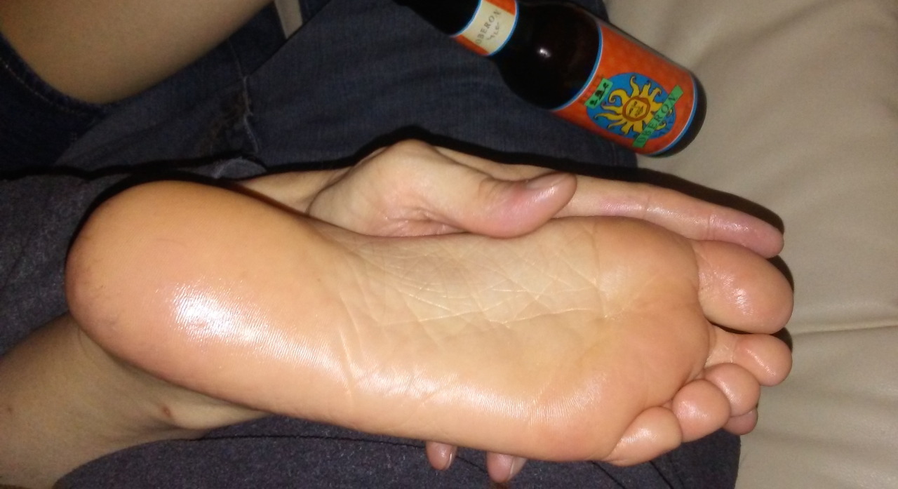 Rubbing lotion on a girlfriend’s feet and enjoying an oberon!