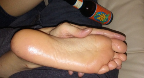 Rubbing lotion on a girlfriend’s feet and enjoying an oberon!