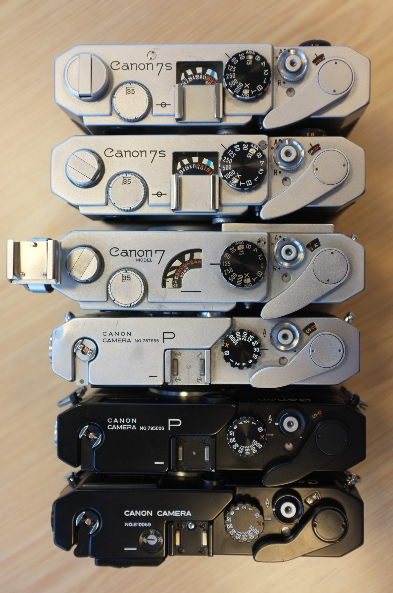 zdp-189:  Canon single speed-dial rangefinders. From top: 7SZ, 7S, 7 (with accessory