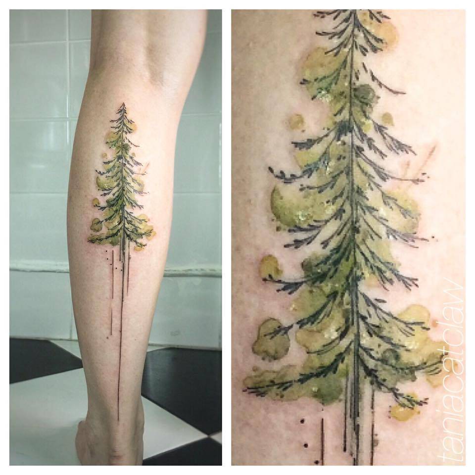 Watercolor tree tattoo on the right inner forearm