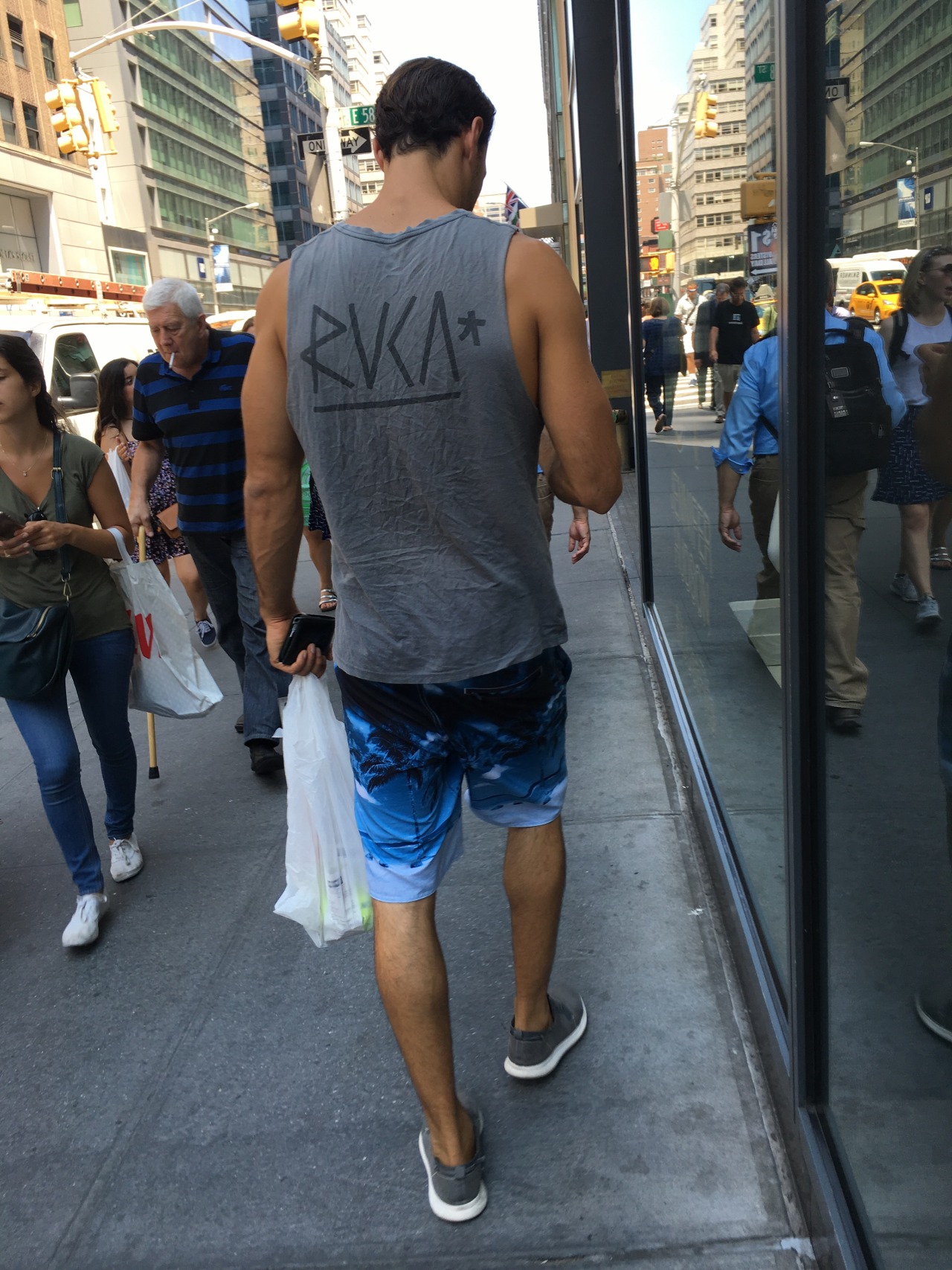 nychotguys:  Tank Top Hottie on Lexington Ave. NYC.Thanks EverydayHotness!
