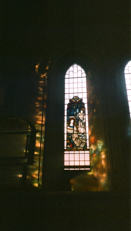 Sun shining through the stained glass at St Mary Abbots church, around 3pmKensington, London / 2016f