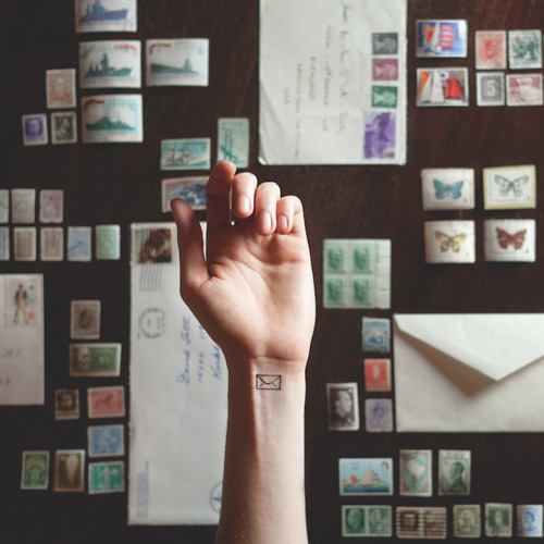 mymodernmet:Photographer Austin Tott pairs the small with the grandiose in his series Tiny Tattoos. 