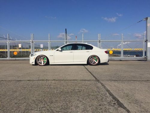 Clean BMW F10 from Japan equipped with Front and rear CEIKA big brake kit, painted lime green finish