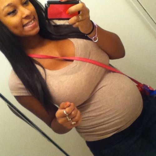 Cute busty pregnant black teen with huge tits!