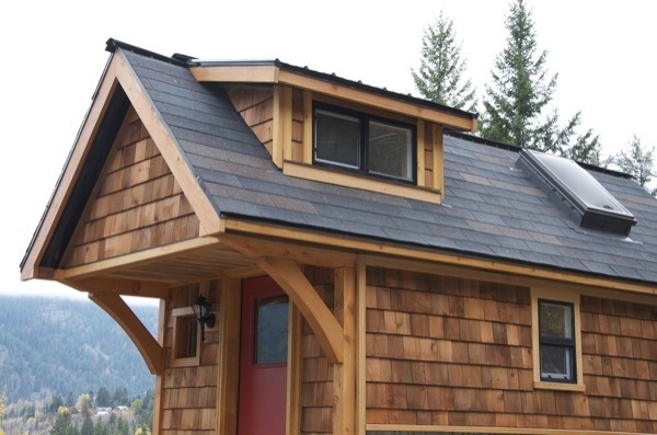 riddick09:  The Acorn tiny house is 14′ by 8.5′ with a covered front porch and