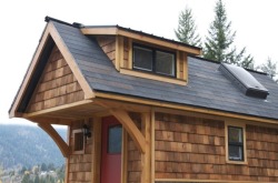 riddick09:  The Acorn tiny house is 14′ by 8.5′ with a covered front porch and gable roof with dormers. You feel spacious while up in the sleeping loft which also has built in storage.  Inside this 120 square foot home you’ll find everything you
