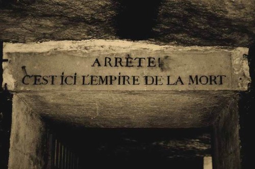 sixpenceee:“Stop! Here lies the empire of death.” Seen in the Paris Catacombs.