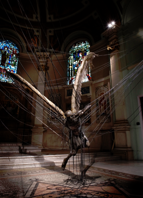 kelsomorgue:  Lucifer (Morning Star) by Paul Fryer(Installation in the Holy Church in Marylebone, 2008. Anodised aluminium, silicon rubber cord, wax work figure, feathers/aluminium, concrete.) 