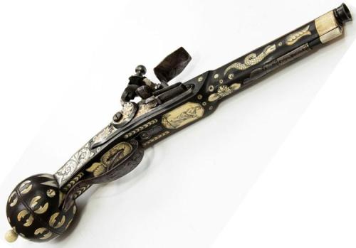 Ivory inlaid flintlock pistol done in Renaissance style, 18th century.from Helios Auctions