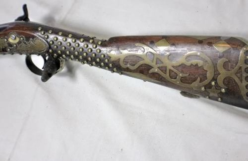 Native American tack and brass decorated percussion musket, mid 19th century.