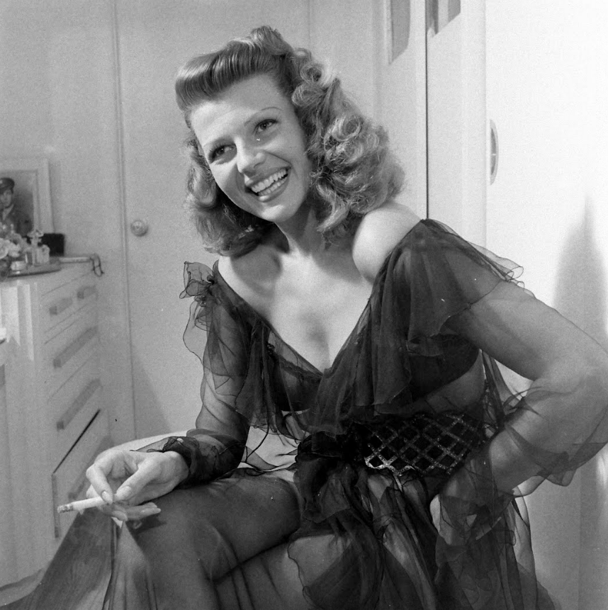 Rita Hayworth photographed by Peter Stackpole for LIFE magazine at home in Beverly Hills, 1945.