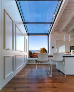 remodelproj:Continuous glazing from roof to wall at kitchen nook area. 