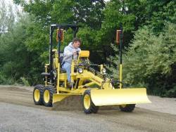 rollerman1:Compact grader with a laser level system installed