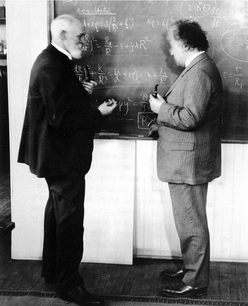  Theoretical physicists; Dr. Willem de Sitter and Albert Einstein discussing equations that describe