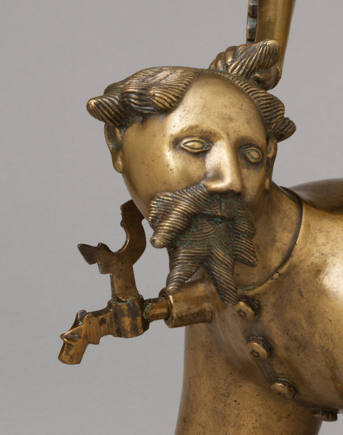 Aquamanile in the Form of Aristotle and Phyllis (c. 14th c.). Detail.An aquamanile is a vessel for p