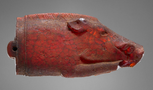 didoofcarthage:Amber pendant in the shape of a recumbent boar. Etruscan, 525-480 B.C. J. Paul Getty 