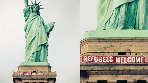 zoekravitzgirlfriend:banner hung on the statue of liberty this afternoon by activists