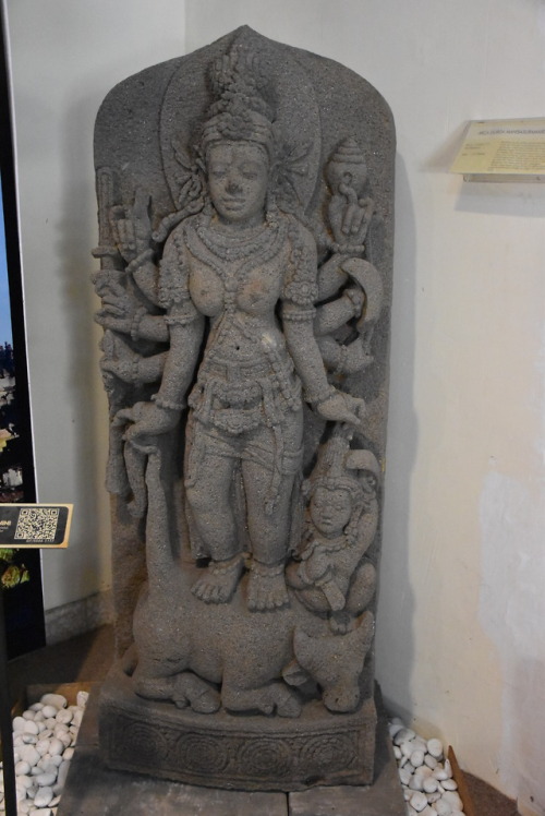 Devī Durgā MahiśāsuramardinīA magnificent stone sculpture of the Goddess Durgā slaying the buffalo-d