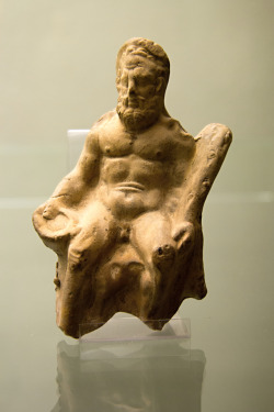 domus-aurea2: lionofchaeronea: Hellenistic terracotta figurine depicting Heracles in repose, perhaps modeled after an original by Lysippus.  Thought to have come from Southern Italy; now in the National Gallery Prague-Kinský Palace.  Photo credit: