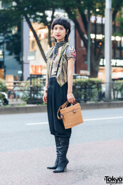 tokyo-fashion:  19-year-old Asako on the street in Harajuku wearing a graphic top by John Galliano with cropped pants, heeled boots, suspenders, and a wicker purse. Full Look