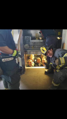 snowflakesandlightning:  redditfront:  Kansas City fire department saves Kansas City police department from elevator. - via http://ift.tt/1StLDQz  That one guy in the middle is regretting all of his life choices 