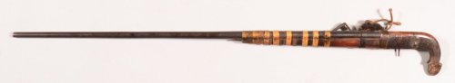 An antique matchlock musket, possibly originating from either China, Korea, or Southeast Asia.  18th